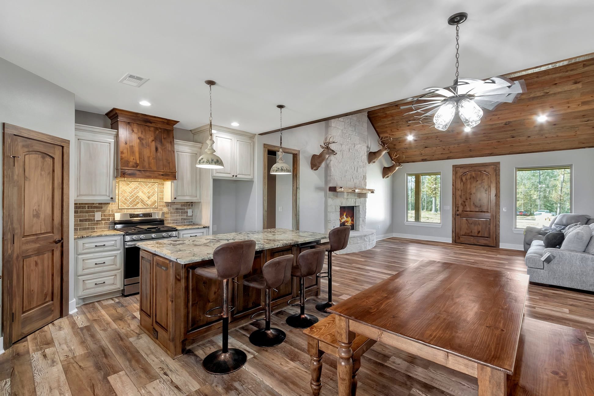 Real Barndominium Pictures: Completed Builds Inside & Out 4 Radcliffe RP-10002 vaulted ceiling and open living space, third view — completed client build